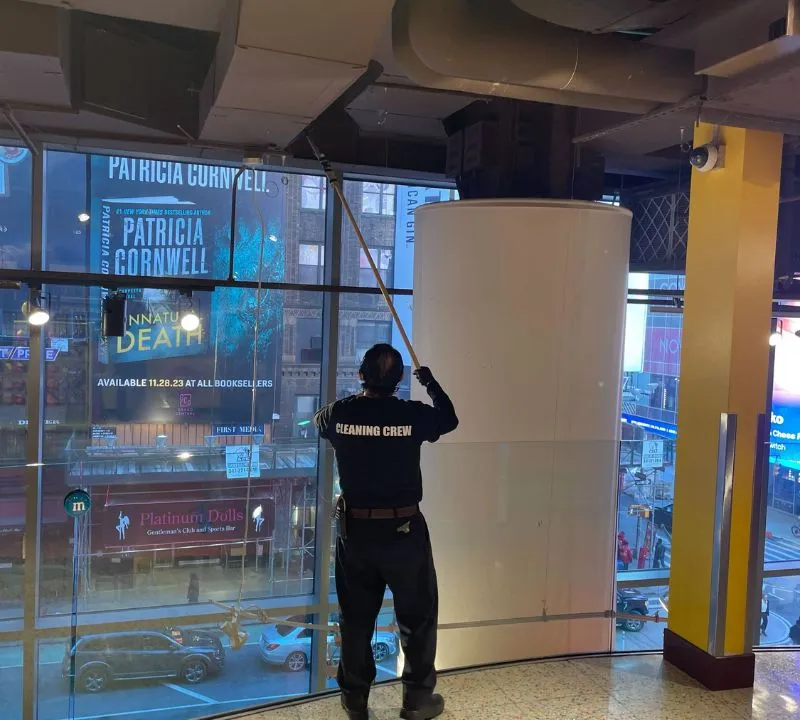 Cleaning windows and high dusting in commercial retail facility